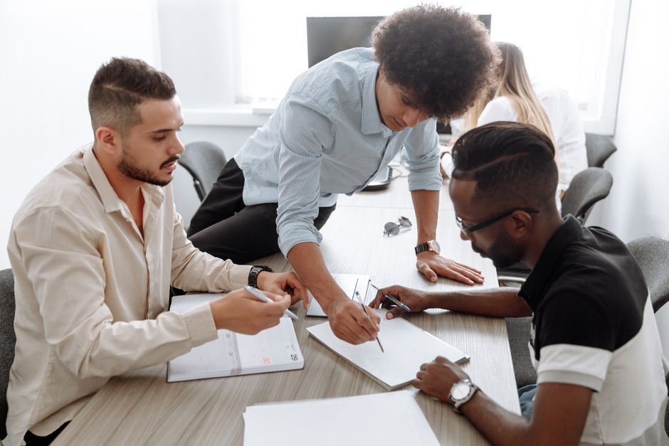 Small business health insurance discussion during a team meeting in an office